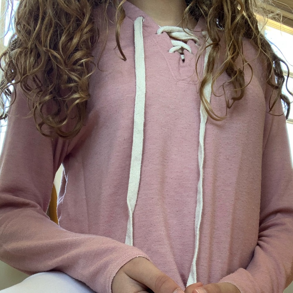 Super soft and comfy lace up sweater!